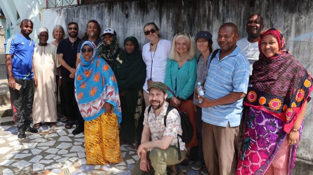 Schmitt (center, kneeling) with Tuko Pamoja participants and partners on Pemba Island