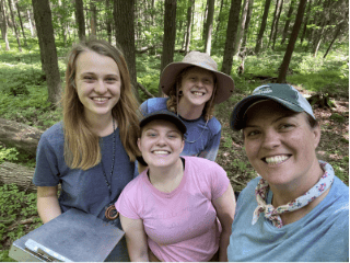 Group of four in woods