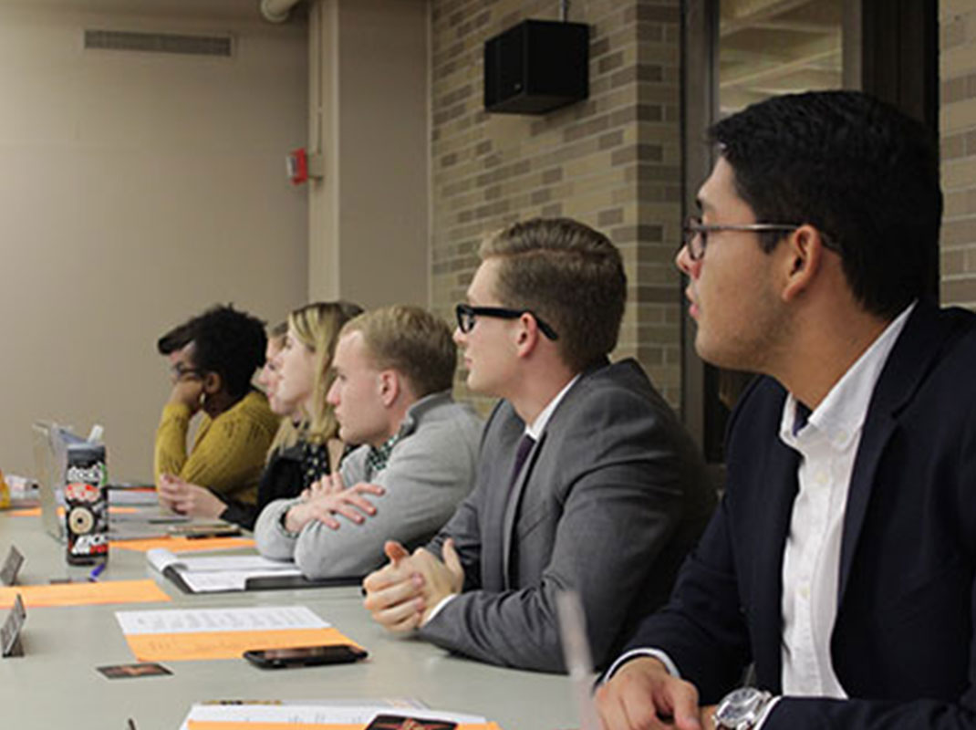 SGA members sitting in presentation