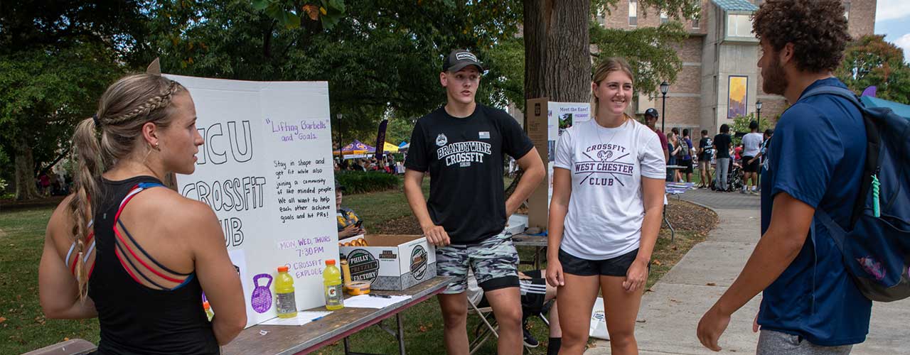 students visting table at the involvement fair