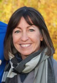 white woman with brown hair smiling