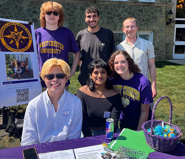 Students working outreach table