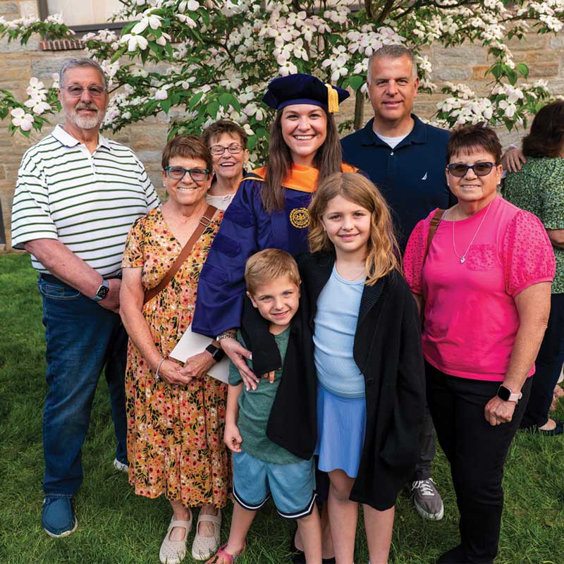 Magazine Cover - 2025 Doctor of Nursing Practice graduate Dr. Megan Carullo and family