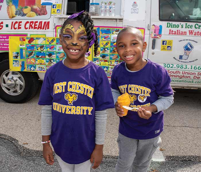 2 young kids wearing all west chester university gear