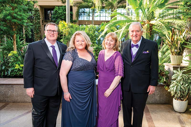 Laurie Bernotsky in a group photo with 3 other people