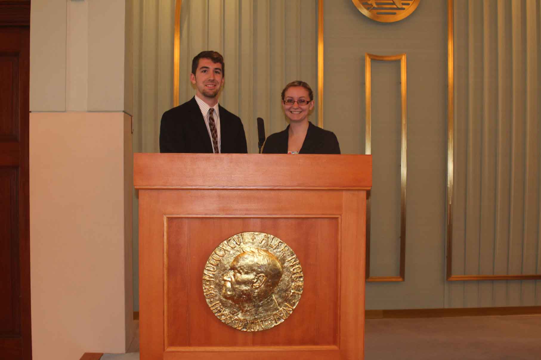 Two people at a podium