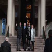 Group posing in front of museum