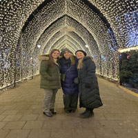 group smiling under lights