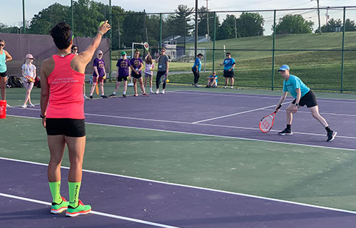 Adaptive PE students playing tennis