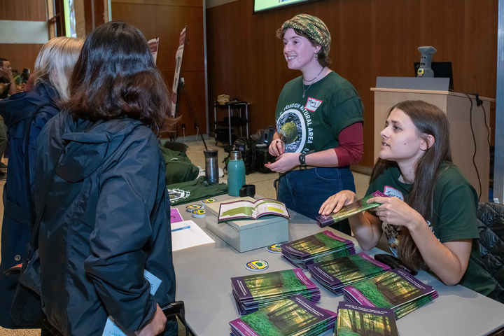 GNA Student Interns Maryteresa Ohara (left) and Jessica Greulich (right) talking about the Gordon with visitors to the festival