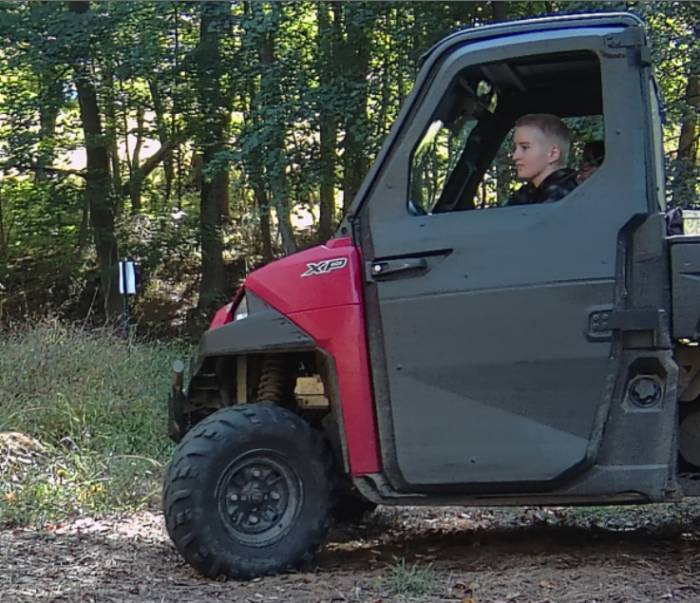 GNA student intern Kinsey Cuoco cruising down the Cattail Trail in the UTV