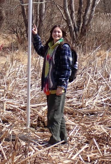 GNA Student Intern Leah Fenton helping install the Purple Martin houses in the Gordon