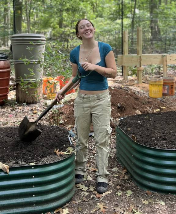 GNA Student Intern Mycah Choby filling the raised beds in the GNA Native Plant Nursery